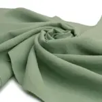 Close-up view of crepe fabric showing its signature crinkled texture