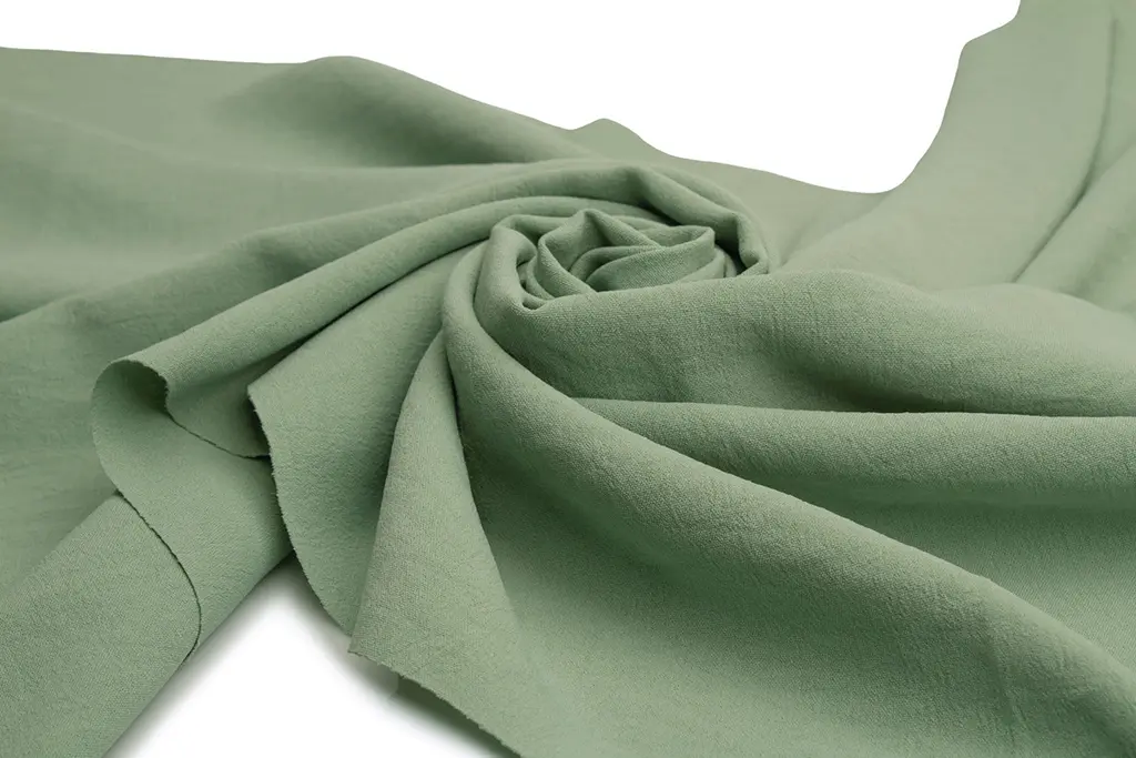 Close-up view of crepe fabric showing its signature crinkled texture